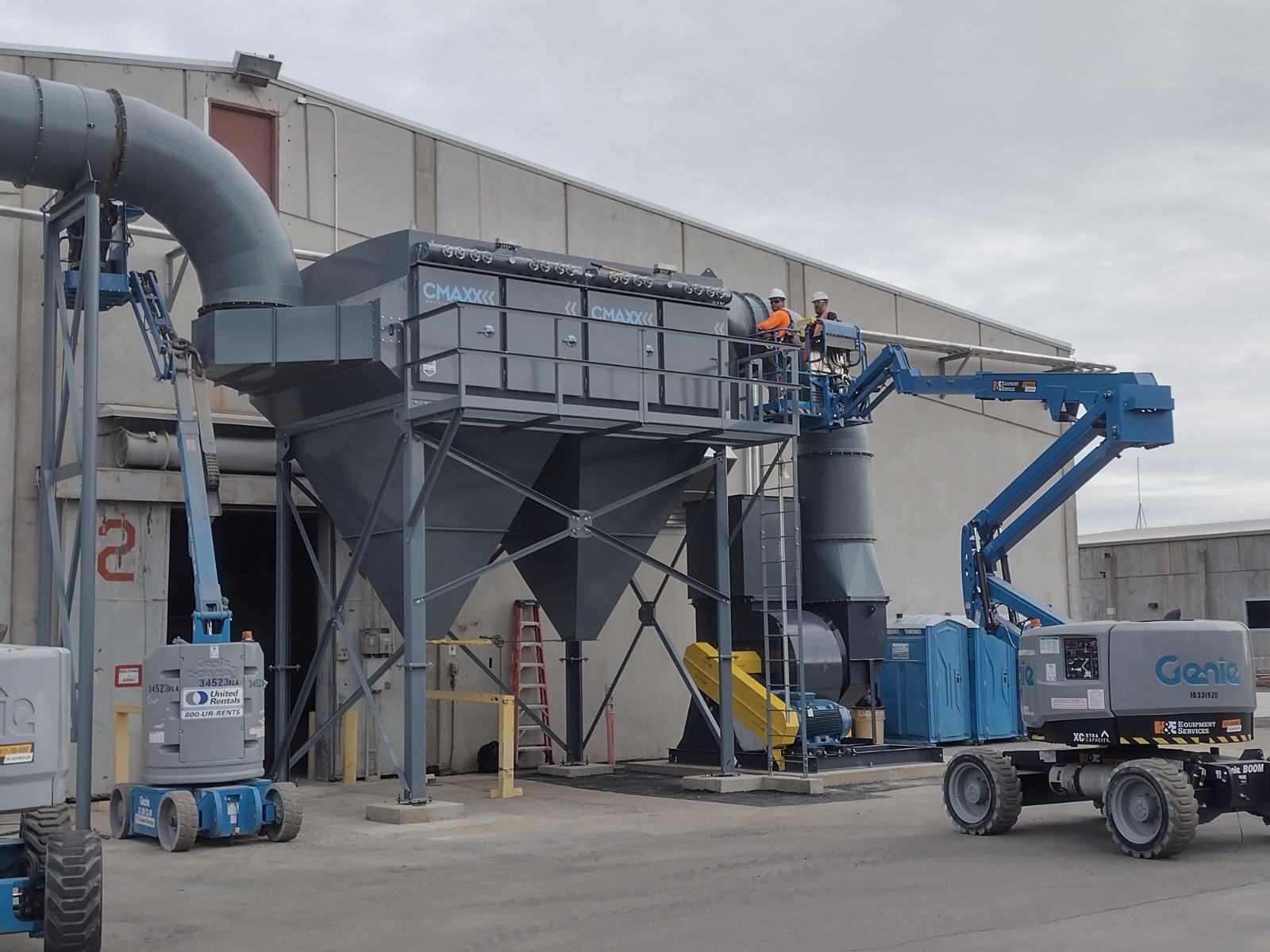 Workers using an aerial manlift for elevated tasks in industrial and construction settings.